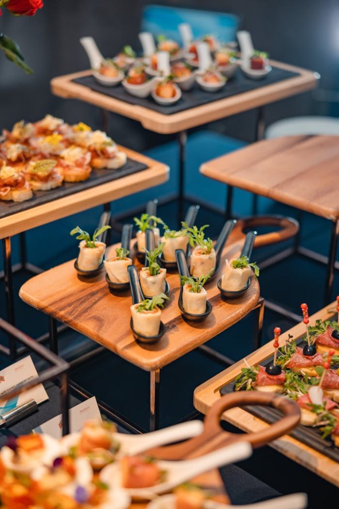A beautifully arranged buffet of assorted finger foods in an upscale restaurant setting.