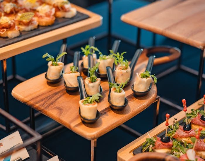 A beautifully arranged buffet of assorted finger foods in an upscale restaurant setting.